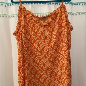 Cute orange blouse.